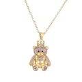 Macro detail of a golden teddy bear pendant with purple zircon inlay and heart shaped feet - Purple(CN001842YH)
