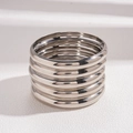 Macro shot of 7-piece polished silver metal bangles showcasing glossy finish and texture - Silver 5-Piece Set