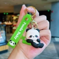 Cute panda baby keychain with green silicone wristband and golden metal lobster clasp - Gen 2 Lying Down