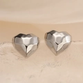 Polished silver heart-shaped stud earrings with geometric facets on a textured surface - Silver Geometric Heart