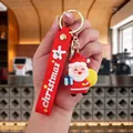 Portachiavi Babbo Natale in PVC con cinturino rosso e pacchetto regalo azzurro - Babbo Natale-2