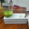 White automatic paintbrush cleaner with transparent tank and green core mechanism - Generation 1 / Green