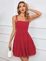 Detail of red tiered mini dress featuring adjustable bow tie straps and layered ruffled hem - S / Red