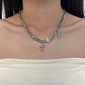 Silver titanium steel necklace with irregular beads and star pendant on a model - Zirconia Surrounded Star Necklace X2845