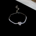 Detail of adjustable silver heart bracelet with sparkling cubic zirconia stones - Silver-White Zirconia