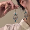 Detailed close-up of exotic silver tassels with blue teardrop beads and teal gemstones - 24# Earring Hook - Silver - Blue