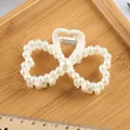Elegant cream white pearl bow claw clip for women shown with scale measurements - Butterfly Hollow