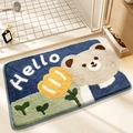 Absorbent plush bathroom mat featuring a cartoon bear and hello greeting text - Bear and Flower