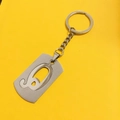Silver stainless steel keychain with hollow number 9 pendant on yellow background - Letter Q