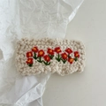 Macro detail of hand-crocheted cream hair clip with red flower and green leaf embroidery - Crochet-White Flower