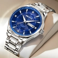 Detail view of a men's quartz watch with a blue dial, diamond markers, and day-date display - Silver Steel Band Blue Dial