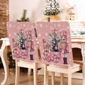 Detailed view of pink Christmas chair covers featuring nutcracker and tree patterns - Pink Nutcracker Scene (YT02-27)