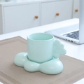 Pale green cloud-shaped ceramic mug and saucer set with a thick handle design - Cloud Cup & Saucer - Mint Green