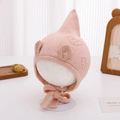 Close-up of pink knit baby hat with ear flaps and cute round ears on a display stand - 3-12 Months / Pink