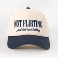 Detail of two-tone baseball cap featuring NOT FLIRTING embroidery on cream cotton fabric - Adjustable / Cream/Navy Blue