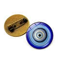 Turkish evil eye amulet brooches showing both front blue eye design and bronze metal back - Bronze-10