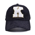 Close-up of distressed baseball cap with white K patch and gold sequin edge detail - Letter K Style (K-漏洞马尾棒球帽)
