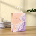 Artistic oil painting kraft paper gift bag with moon pattern and white handles on a table - 62-2 (Orange Pink Oil Painting Clouds Moon)