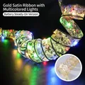Gold Christmas LED ribbon with multi-color lights and festive star pattern print - Gold Ribbon Multicolor Light
