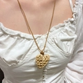 Close-up of Bohemian woven heart necklace with wooden bead on white clothing - Heart-shaped Wood Bead Woven Necklace (DZ-304)