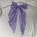Elegant purple satin bow hair clip with long ribbons on white textured background - Light Purple