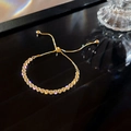 Sparkling gold adjustable bracelet with dense cubic zirconia and sliding clasp closure - S175 Gold