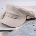 Fashionable cream white PU leather newsboy hat with buckle detail on magazine background - Simple Flat Top / Beige
