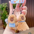 Cute brown plush keychain featuring cartoon beavers with blue accessories and ball racket - Badminton Duo