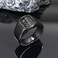 Macro shot of a black punk skull ring reflected on a dark mirrored surface with rocks - US 7 / Black
