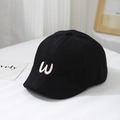 Close-up of black cotton baby beret with white embroidered letter W for casual style - 50cm 1-3 Years / Black