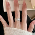 Vintage style silver ring with intricate floral cutout design worn on finger - Silver Floral Botanical Hollow Textured Ring (J6645)