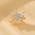 Close-up of golden flower brooch with marquise-cut zircons and sparkling center details - XZ6 Radiant Flower