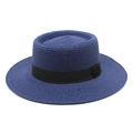 Detailed view of the navy blue straw boater hat featuring a black grosgrain ribbon band - Navy Blue