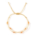 Double-layer woven gold rope bracelet featuring orange crystal beads and adjustable slide knot - Gold Orange