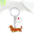 Metal keychain featuring brown dachshund charm and I Love Dogs pendant on white surface - Brown Dachshund (Brown Long Dachshund Heart)