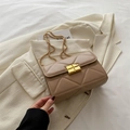 Beige quilted crossbody bag with gold chain strap and turn-lock closure on blazer - Khaki