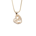 Gold heart MOM pendant necklace with sparkling cubic zirconia on white background - Mom Letter Hollow Heart (CN001172)