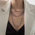 Close-up of three-layer gunmetal grey pearl necklace worn with a white blazer - 8# Necklace—Grey Glass Pearl
