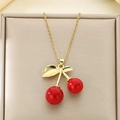 Detailed view of a gold cherry pendant necklace with red round charms in a jewelry box - Gold Leaf Red Double Cherry Style (KN292075-Z)