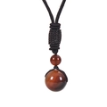 Détail de deux perles en œil de tigre de 16mm sur un collier en cordon tressé noir - Collier Agate-1