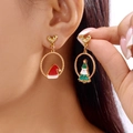 Pink Christmas tree and red hat earrings with gold heart studs on model - Heart Stud Christmas Hat Tree Hoop (ER25Y0271-2)