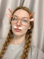 Close-up of reindeer Christmas party glasses with hanging beard accessory on a model - Coffee / Transparent Lens Antlers