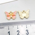 Detail of pink enamel butterfly charm showing 15mm size measurement and golden metal back - 1Pc Pink & Yellow Gradient Drip Oil Butterfly / 10*14mm