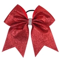 Detail of a red glitter hair bow with sparkling rhinestone centerpiece on black elastic - Red
