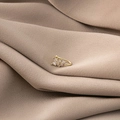 Gold leaf ear cuff with micro-pave crystals on soft beige fabric background - Leaf Shape (E4651-2)
