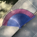 Purple and blue gradient folding fan on stone steps for Chinese style dance and photography - Hollow Crescent Blue Red