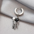 Silver astronaut hoop earring with star detail on elegant gray silk background - Astronaut Pendant Hoop