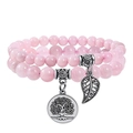 Pink crystal bead bracelet set with silver tree of life and leaf pendants on white background - Rose Quartz