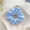 Light blue daisy print mesh scrunchie with a soft ruffled texture for summer hair styling - Blue Flower
