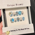 Unghie finte fatte a mano blu cielo french con fiocchi 3D e strass in confezione - Extra Piccolo (XS) / Extra Short Coffin